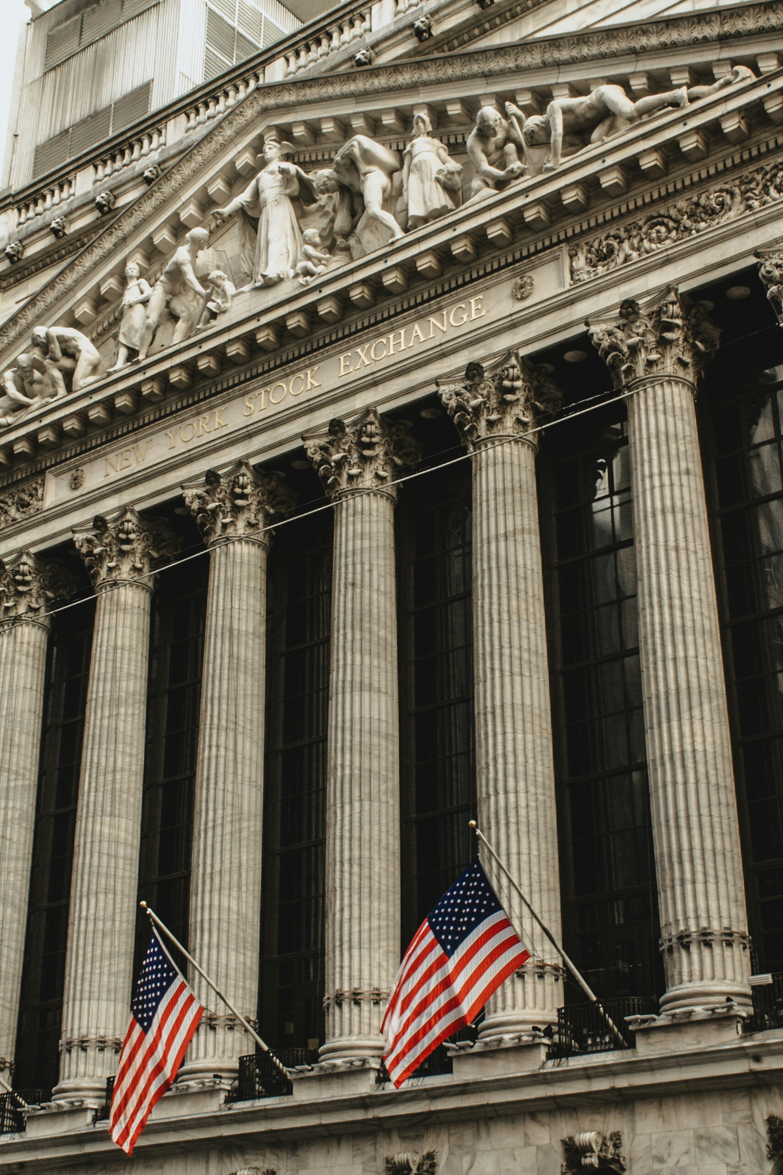Grand neoclassical stock exchange facade with towering columns